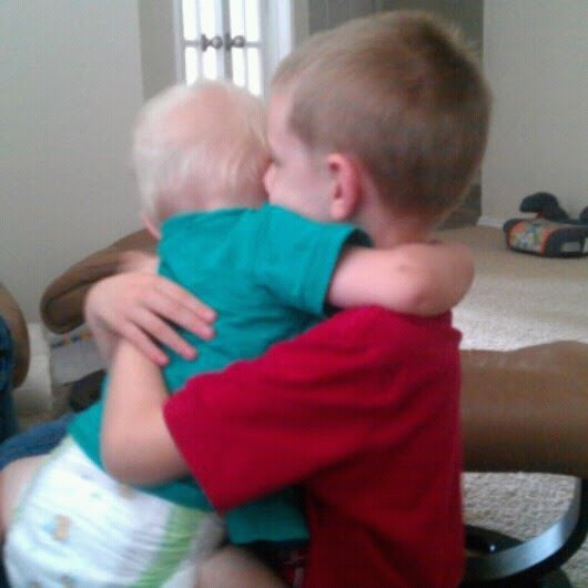 Brotherly love.  Biggest brother and littlest brother.  I love this so much, I can hardly stand it. <3