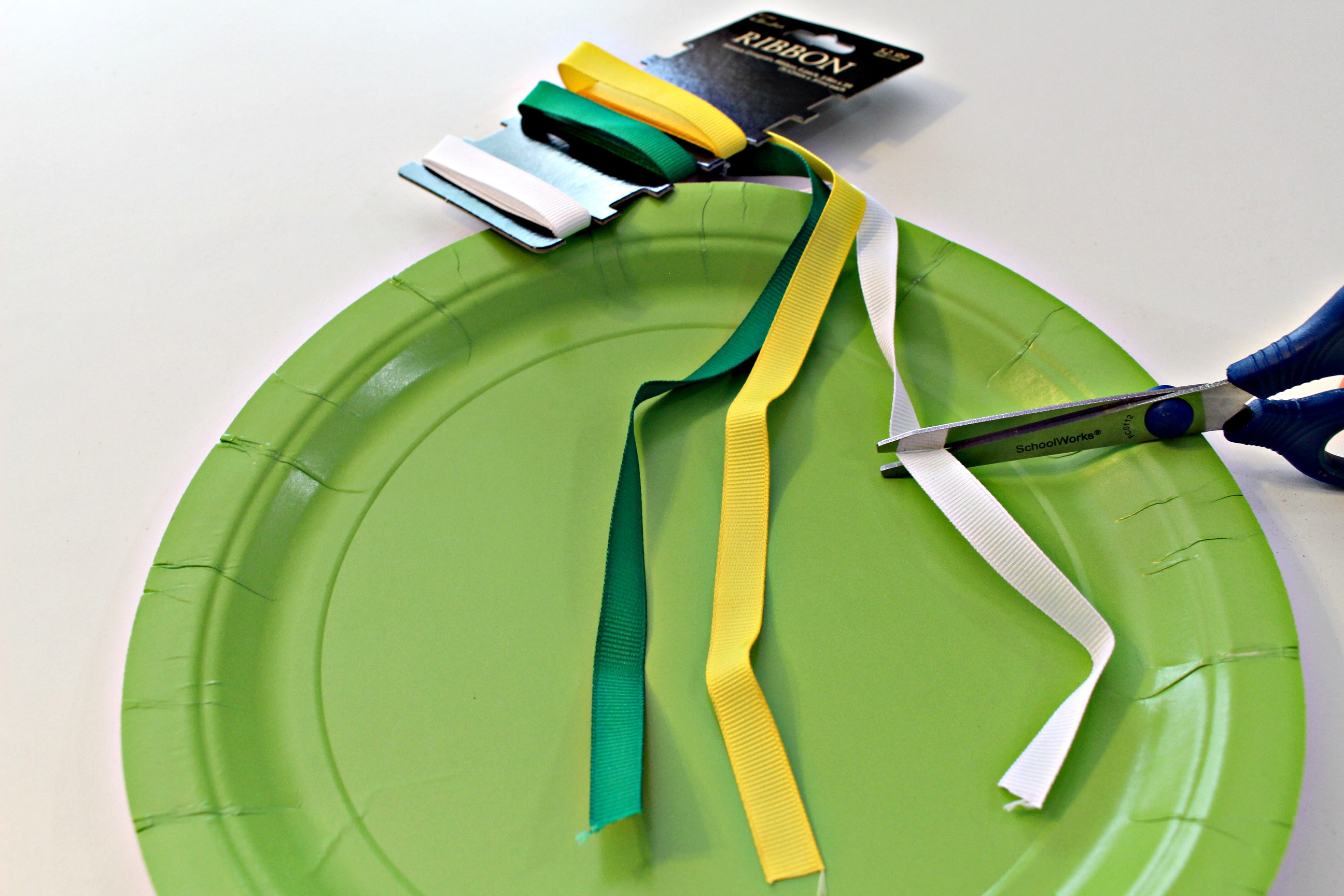 Owl Paper Plate Craft - Cutting the ribbon